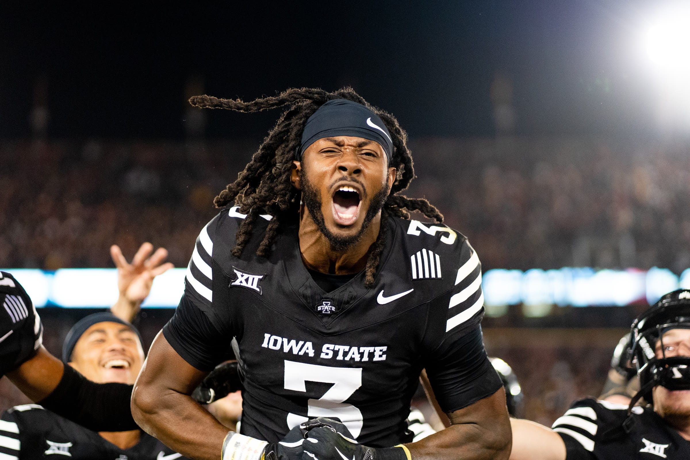 College football player celebrating and shouting during a game