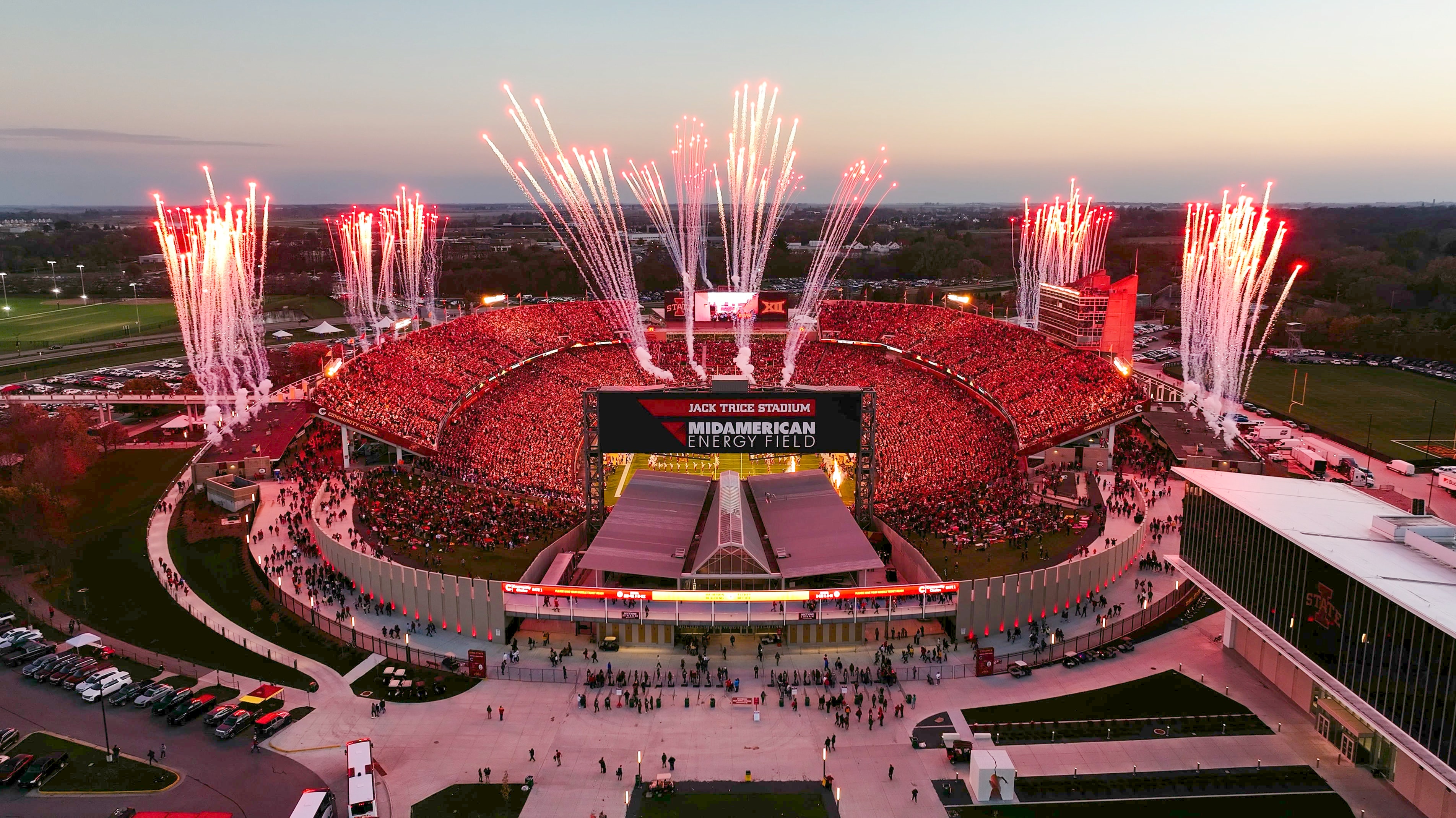 Aerial view of red fireworks over Jack Trice Stadium at night